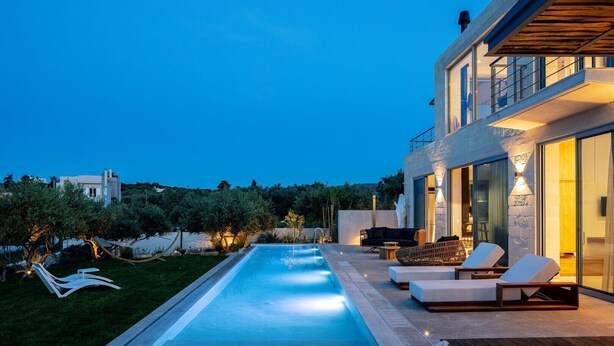 A modern outdoor pool area with lounge chairs and a dining set. - BRAND NEW Lux Villa*Private Heated SaltyPool*BBQ*SeaView (Daratsos)