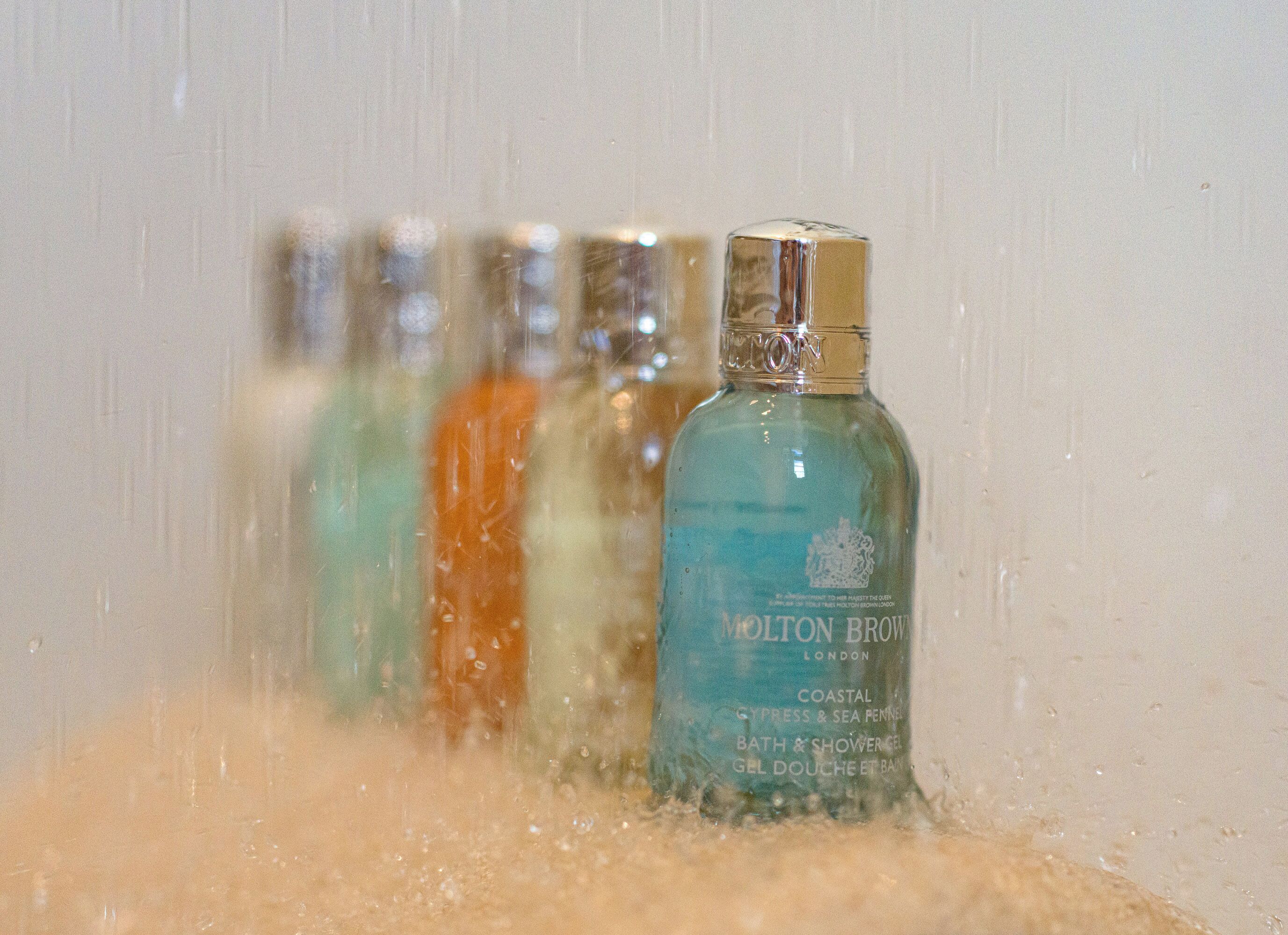 A bottle of Molton Brown bath and shower gel with a label indicating it is from London.