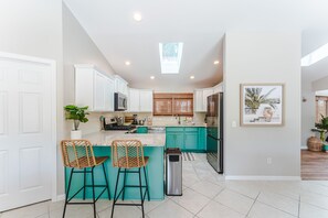 Fridge, microwave, oven, stovetop - Spacious 5BD Retreat • Heated Pool + Sauna • 2 Blocks to Beach • Game Room (Port St. Joe)