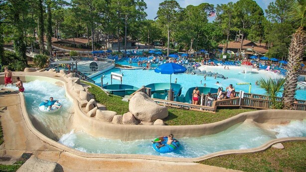 A water park with multiple pools, slides, and a wave pool. - Heated Pool • Sauna • Hot Tub • Game Room • Beach • Golf Cart • Sleeps 15 (Port St. Joe)