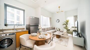 Classic Apartment | Living area | 65-inch Smart TV with digital channels, TV, streaming services