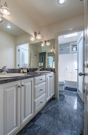 Bathtub, hair dryer, towels, soap
