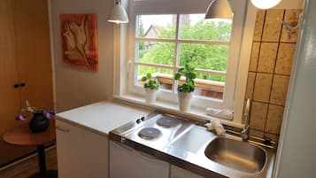 Apartamento urbano | Cozinha privada | Geladeira, cooktop, cafeteira/chaleira, chaleira elétrica