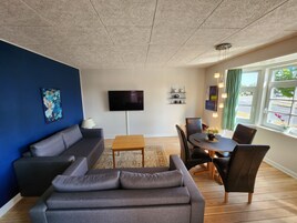 Apartamento City | Zona de estar | Una televisión de pantalla plana, Netflix, servicios de streaming