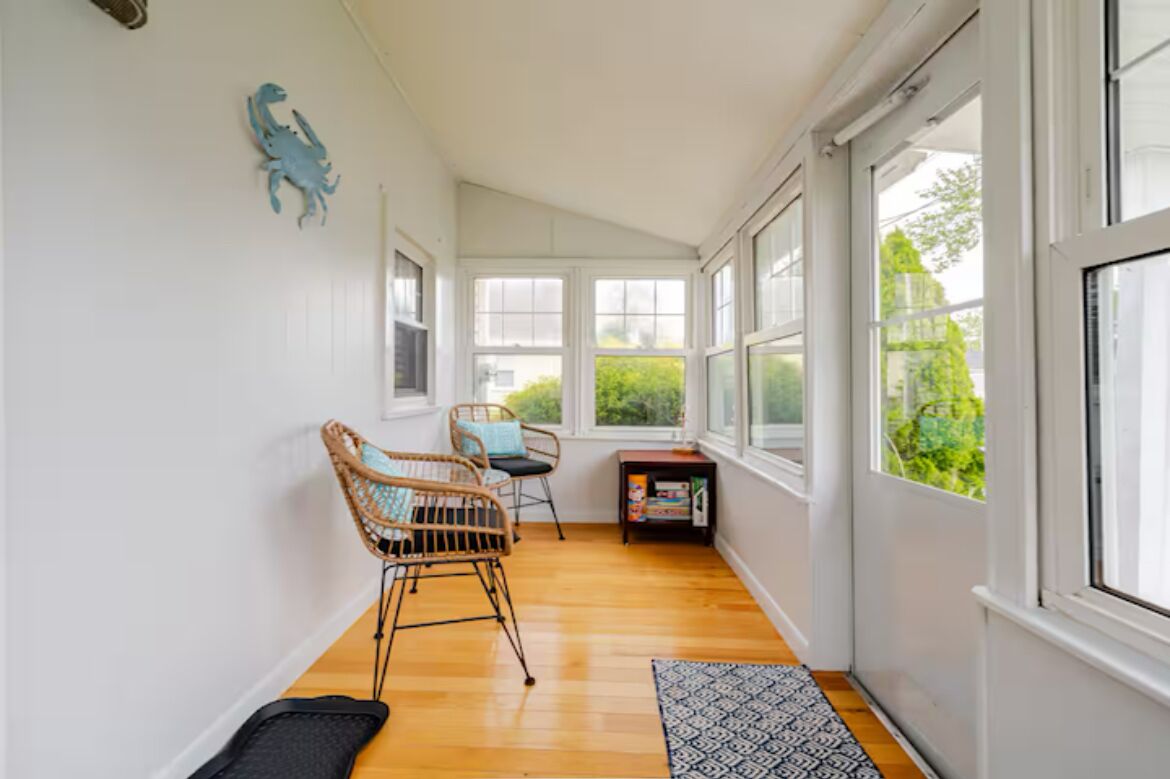 Enclosed front porch with seating, board games, puzzles and children’s books