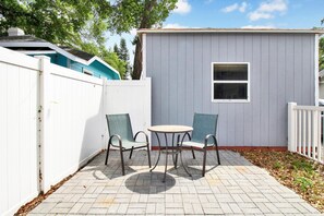 Relax in this serene patio with a comfortable seating area.