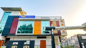 A modern hotel with a prominent 'Tab Hotels' sign, large windows, and a contemporary architectural design. - Fabhotel Shree Pushpraj (Kanpur)