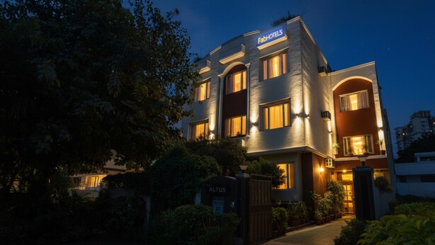 A modern hotel with a sign reading "FadHotels" at the top. - FabHotel Altus - DLF CyberHub, Gurugram (Gurugram)