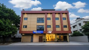 A modern building with a sign for 'FabHotels' and 'Ayon Suites'. - Fabhotel Arton Suite (Mumbai)