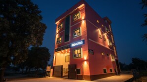 A multi-story building with a sign for 'Hotel Lumbini' and 'FabHotels'. - FabHotel Lumbini International (Varanasi)