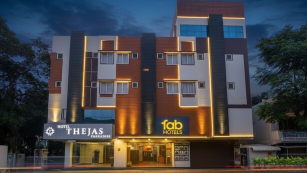 A multi-story hotel with a modern facade, featuring a prominent '1ab Hotels' sign. - Fabhotel Thejas Paaradise (Coimbatore)