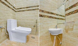 Habitación Deluxe | Baño | Regadera, regadera tipo lluvia, amenidades de baño gratuitas, toallas 