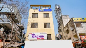 A hotel with a sign for 'Orchid Rooms' and 'Fab Hotels'. - FabHotel Destination 42 (Pune)