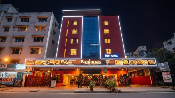 A hotel with a modern facade, featuring a prominent sign for 'Ranjana's' and 'FahHOTELS'. - Fabhotel Ranjanas (Paud)