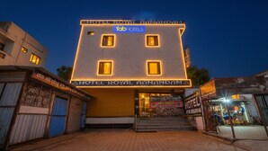 A hotel with a sign reading "HOTEL ROYAL HANANDAM" and "Tab Hotels". - Fabhotel Royal Aanandam (Gwalior)