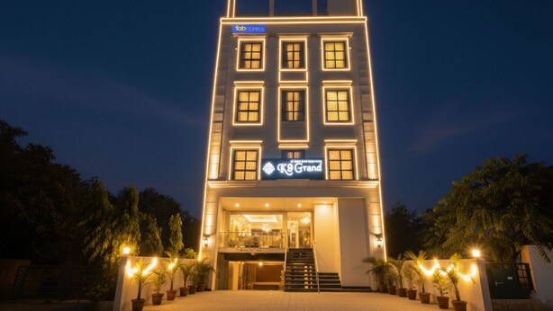 A hotel with a modern facade, multiple windows, and a sign for 'KG Grand'. - Fabhotel Prime K9 Grand (Ludhiana)