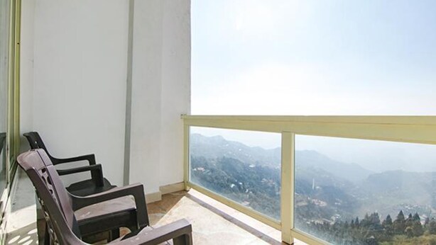 A balcony with a view of mountains.