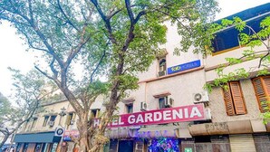 A building with a sign reading "EL GARDENIA" and a "fab HOTELS" sign above it. - FabExpress Gardenia (Kolkata)