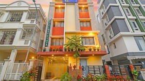 A multi-story hotel with a modern facade, balconies with potted plants, and a prominent 'fabHOTELS' sign. - Fabhotel Dak Plaza (Barasat)