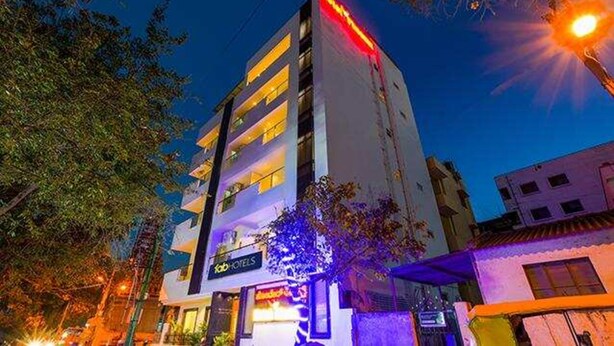 A multi-story hotel with a sign reading "Hotel". - Fabhotel Phoenix Brookfield (Bengaluru)