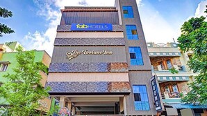 A multi-story building with a sign for 'FabHotels' and 'The Fortune Inn'. - FabHotel The Fortune Inn - Chromepet (Chennai)
