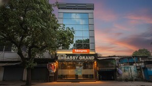 A hotel named "Embassy Grand" with a modern facade and large windows. - FabHotel Embassy Grand (Mumbai)