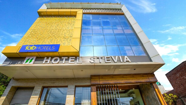 A modern hotel with a prominent 'Tab Hotels' sign and 'Hotel Stevia' nameplate. - Fabhotel Stevia (Dera Bassi)