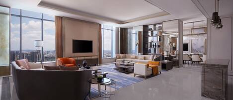 A spacious living room with a large sofa, coffee table, and a flat-screen TV. There is a dining area with chairs and a chandelier. The room has large windows offering a city view.