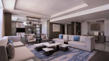 A modern living room with a sectional sofa, a coffee table, and a dining area with a chandelier.