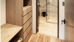 A modern bathroom with a wooden vanity, a glass shower enclosure, and a wooden floor. - Charming Authentic Mexican Hideaway in Roma Norte (Mexico City)