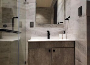 Shower, hair dryer, towels, soap