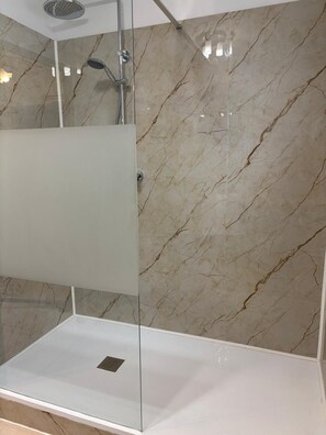 Shower, hair dryer, towels, toilet paper