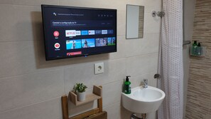 Shower, eco-friendly toiletries, hair dryer, towels