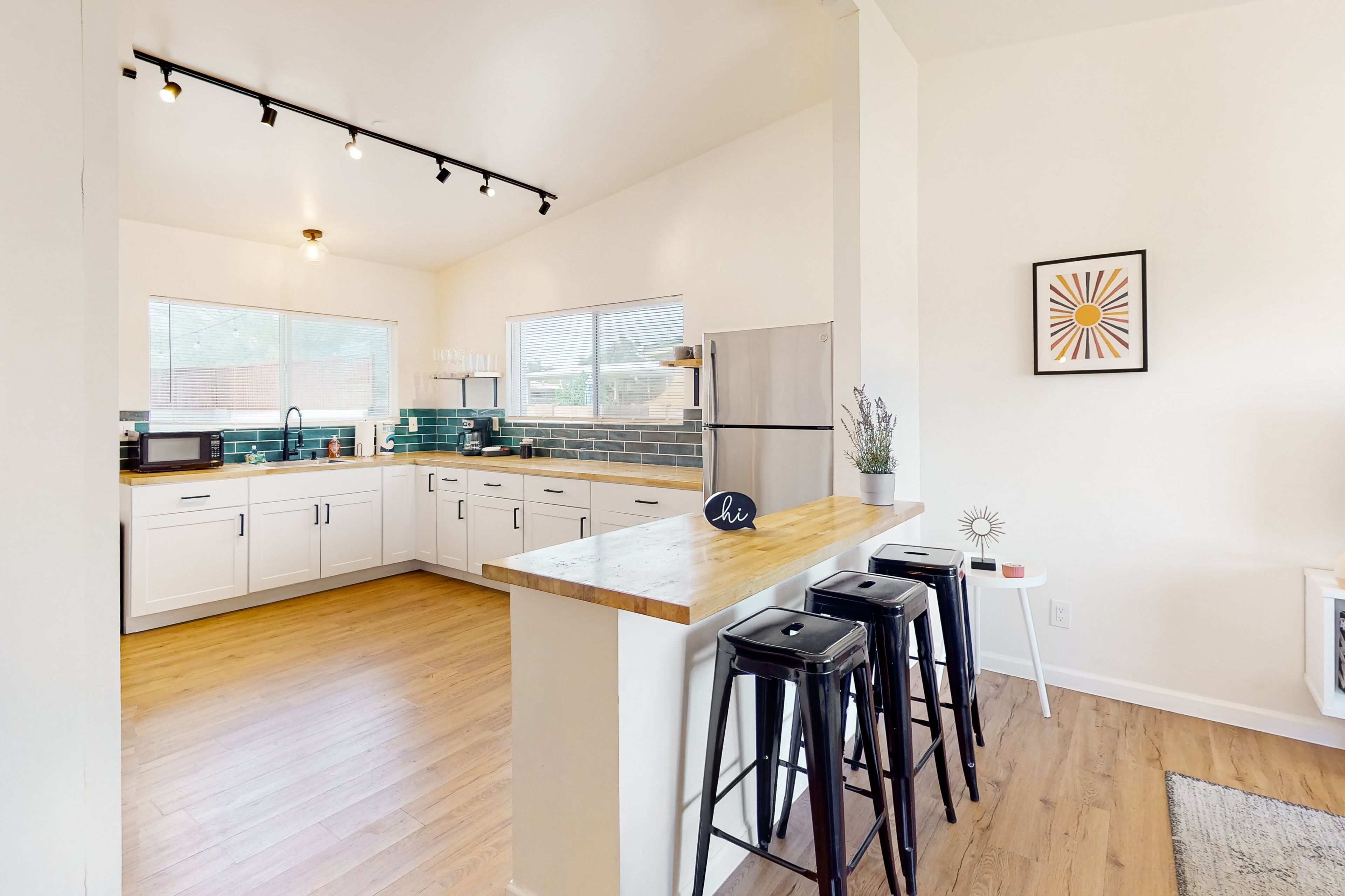 Inviting dog-friendly triplex with full kitchen, central AC, & W/D