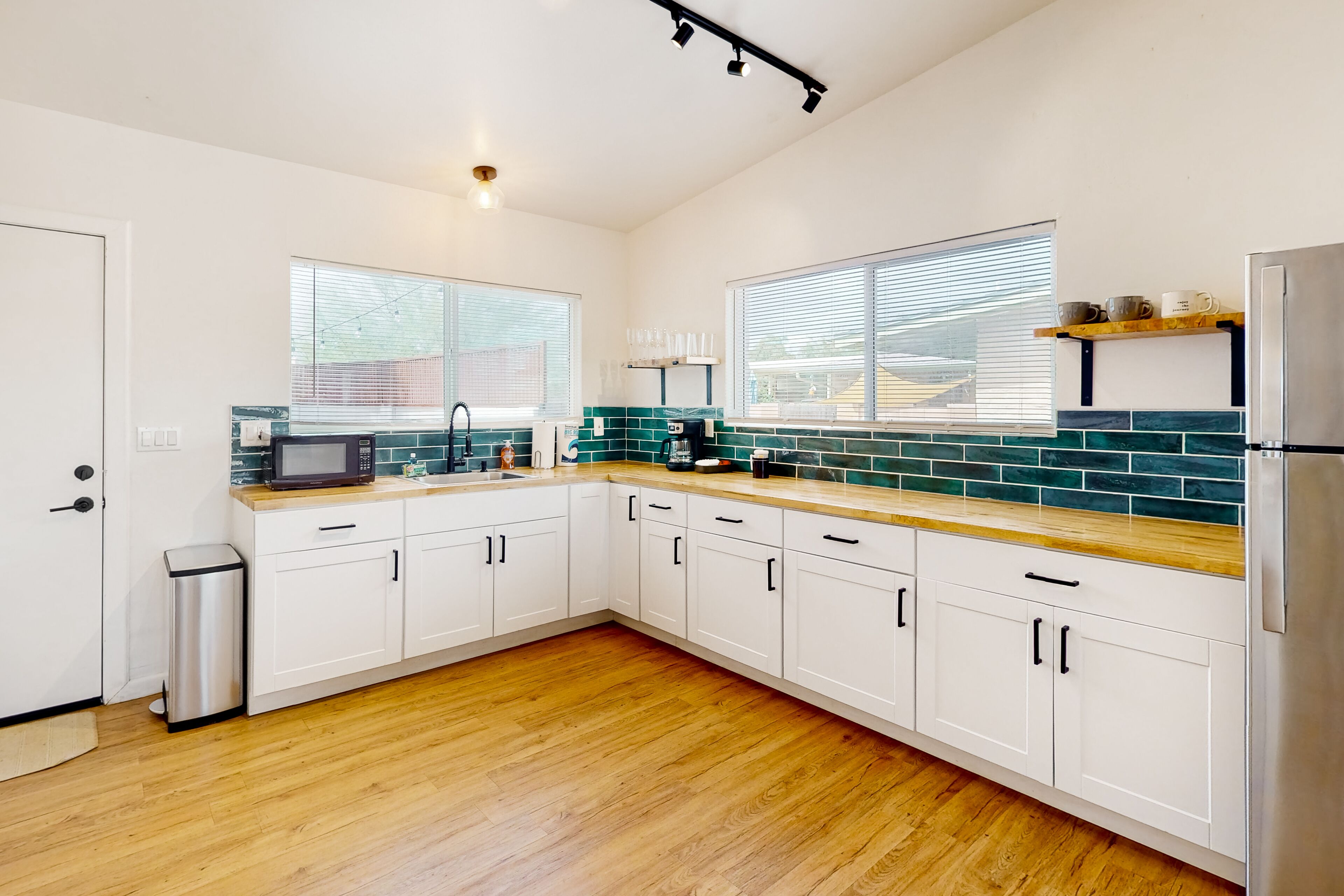 Inviting dog-friendly triplex with full kitchen, central AC, & W/D