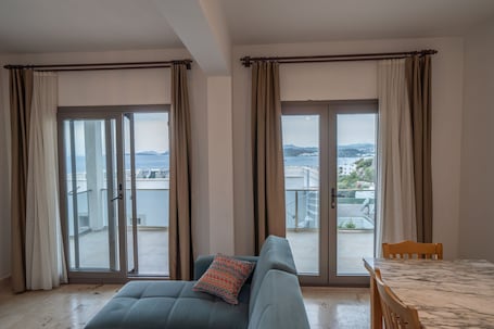 Apartment, 2 Bedrooms, Sea View | Living area | TV