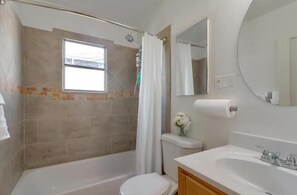 Hair dryer, towels, shampoo, toilet paper