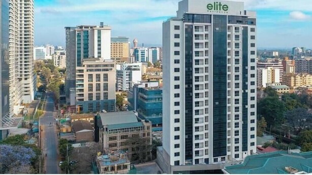 A high-rise hotel with a prominent 'elite' sign, surrounded by other buildings in an urban setting. - Elite Signature (Nairobi)