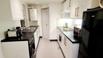 Apartment, 1 Queen Bed | Private kitchen | Fridge, microwave, oven, stovetop
