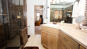 Bathtub, hair dryer, towels, shampoo