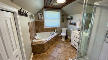 Shower, jetted tub, hair dryer, towels