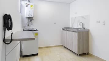 Mini-fridge, cookware/dishes/utensils, cleaning supplies, paper towels