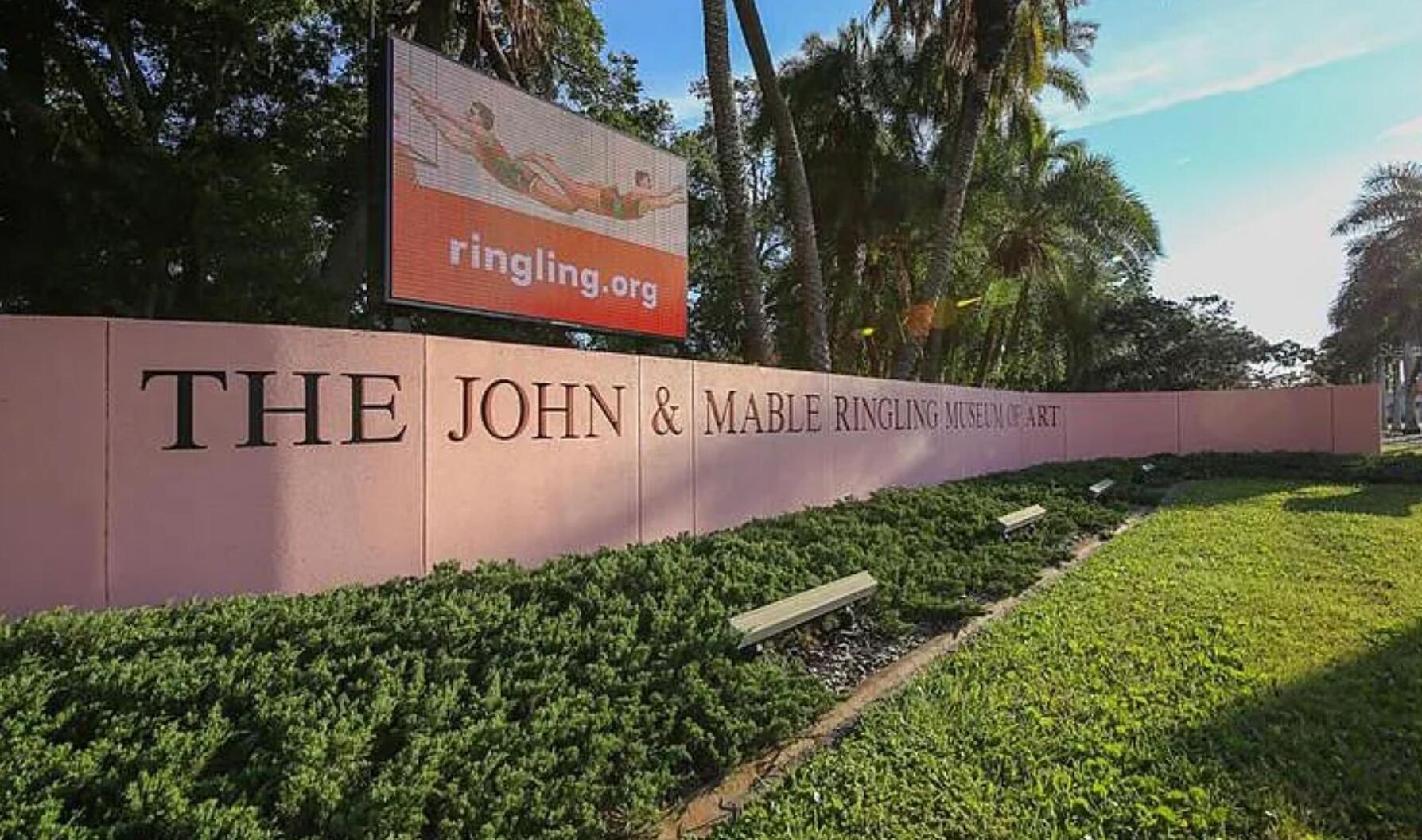 A sign for The John & Marble Ringling Museum of Art with a website address.