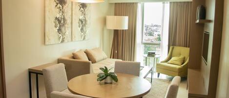 Executive Suite | Living area | 32-inch LCD TV with satellite channels