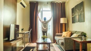 Deluxe Suite | Living area | 32-inch LCD TV with satellite channels - The Padgett Suites Cebu (Cebu City)