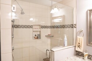 Shower, hair dryer, towels, shampoo