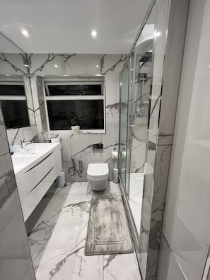 Hair dryer, bidet, towels, soap