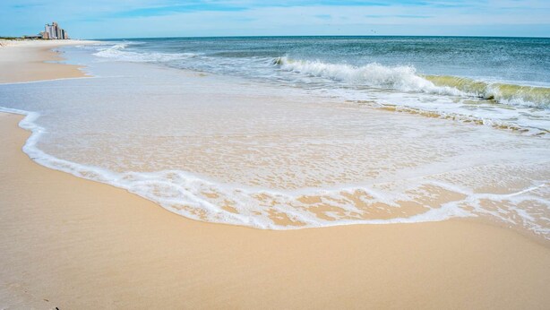 A beach with a sandy shore and ocean waves. - Private Saltwater Heated Pool |8 Bikes |Walk to Johnson Beach |Single Level |Screened Lanai (Pensacola)