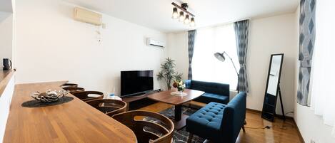 Superior Apartment | Living area | Flat-screen TV