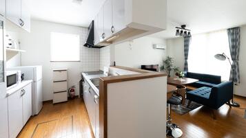 Superior Apartment | Private kitchen | Full-size fridge, microwave, stovetop, electric kettle